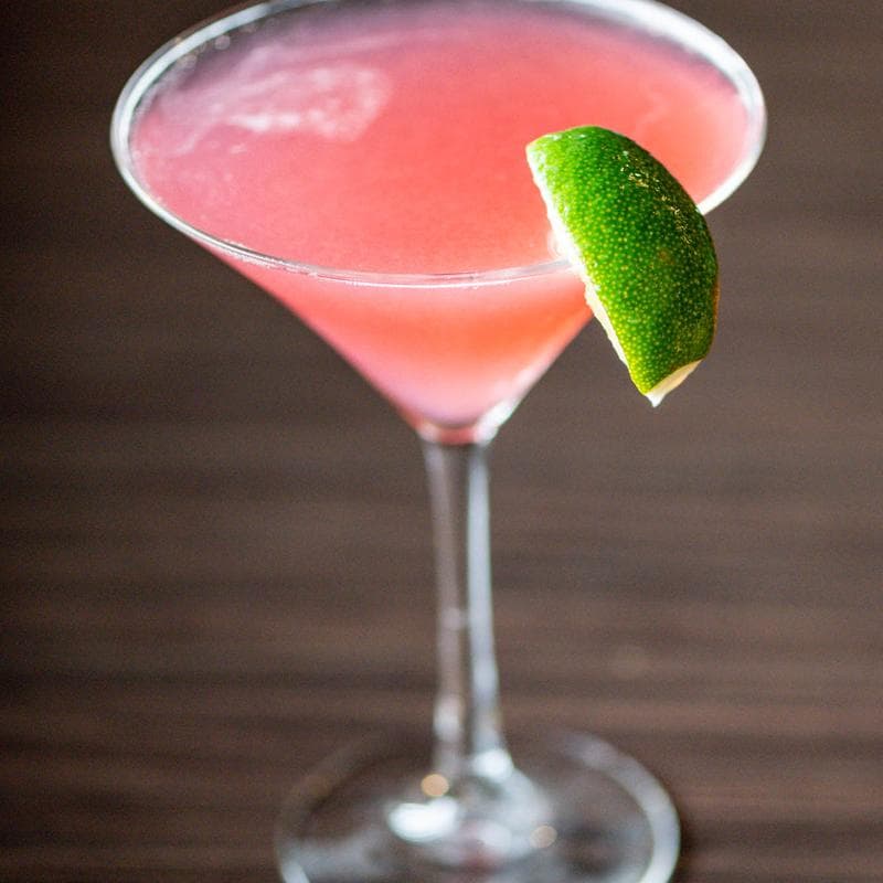 Pink martini with a lime wheel